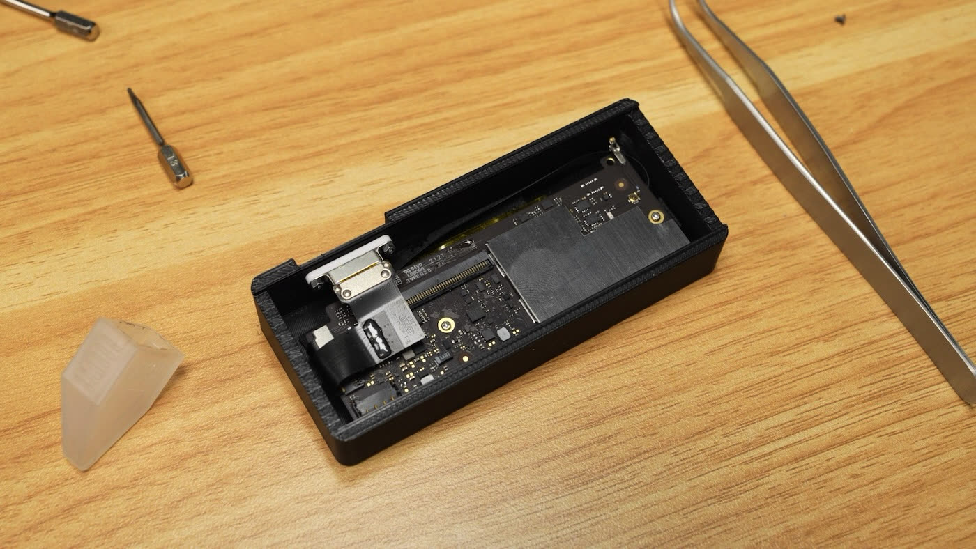 Close-up of the Touch ID button separated from the keyboard